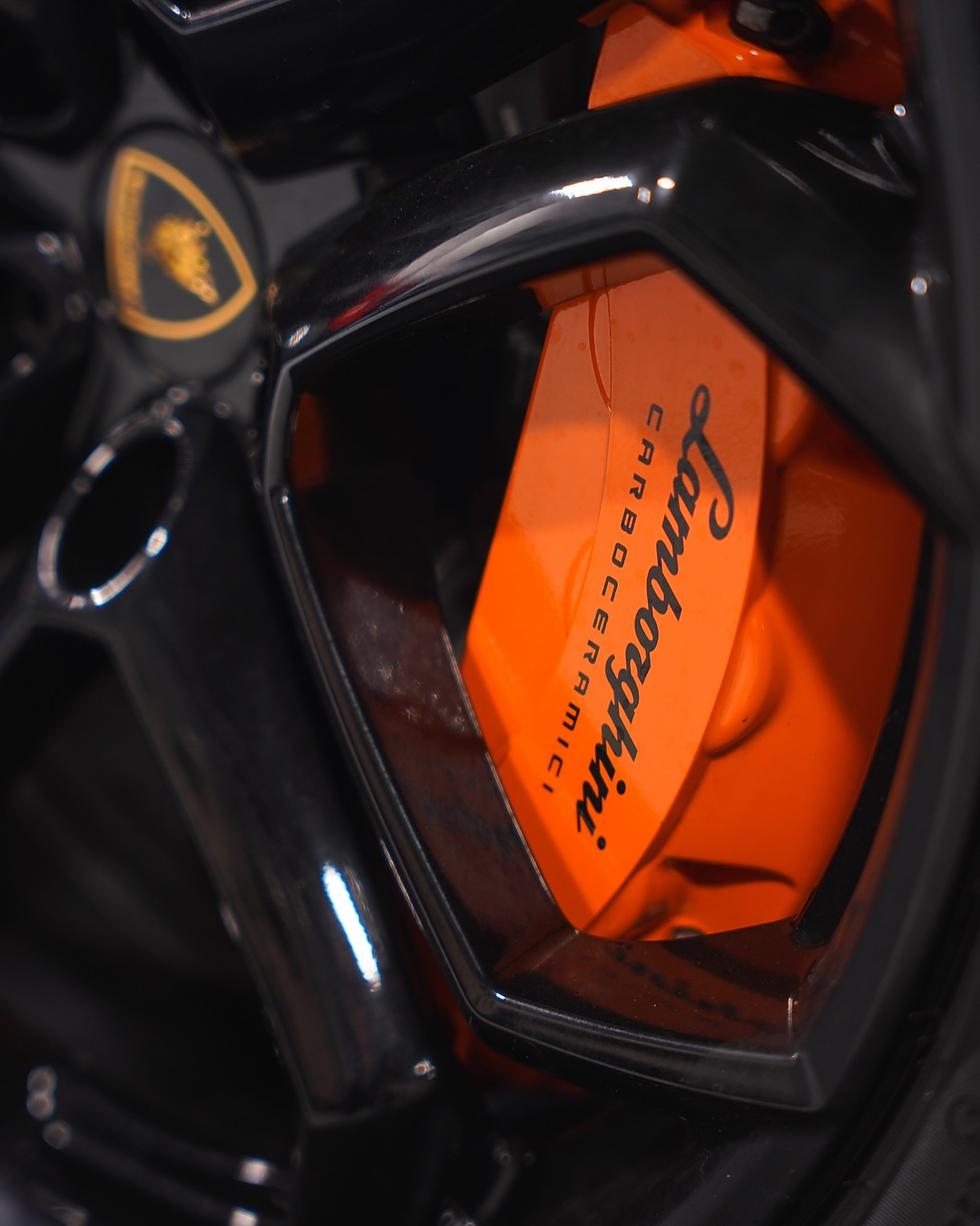 Orange Lamborghini brake caliper