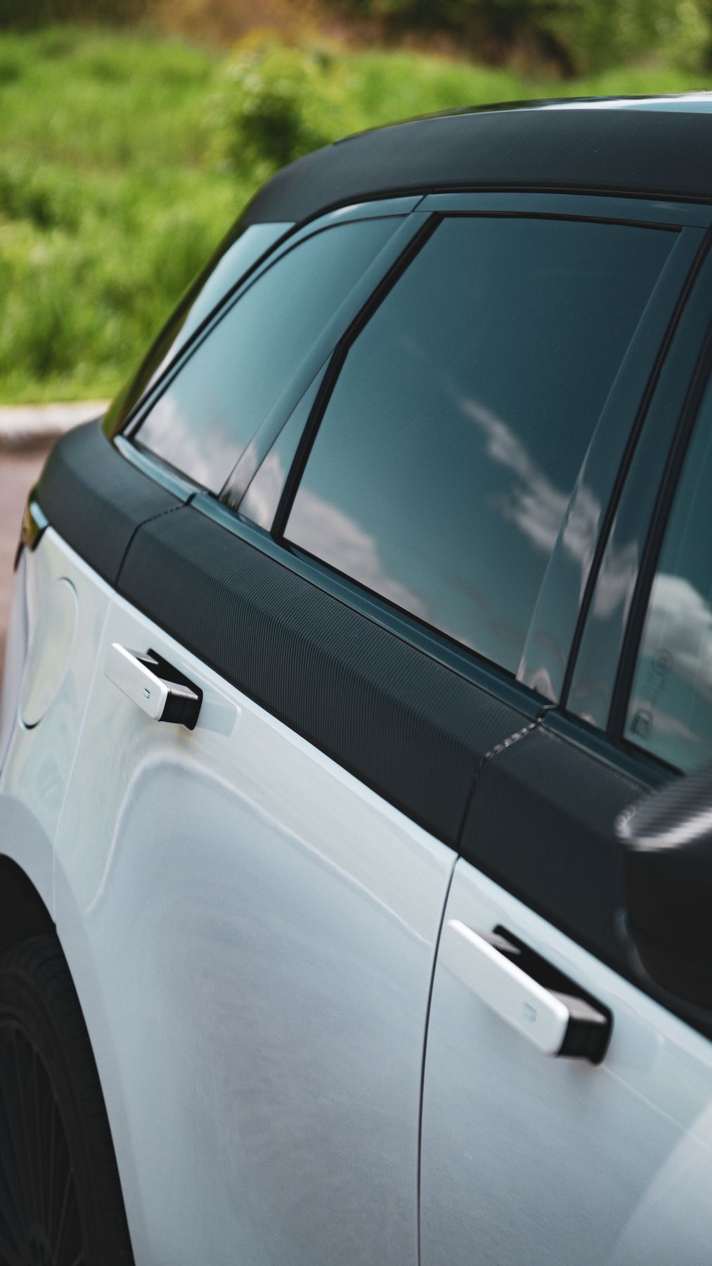 Velar door with blacked-out trim and roof